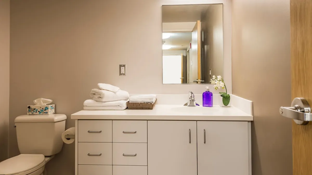 Summer Accommodations washroom looking at sink, mirror and toilet